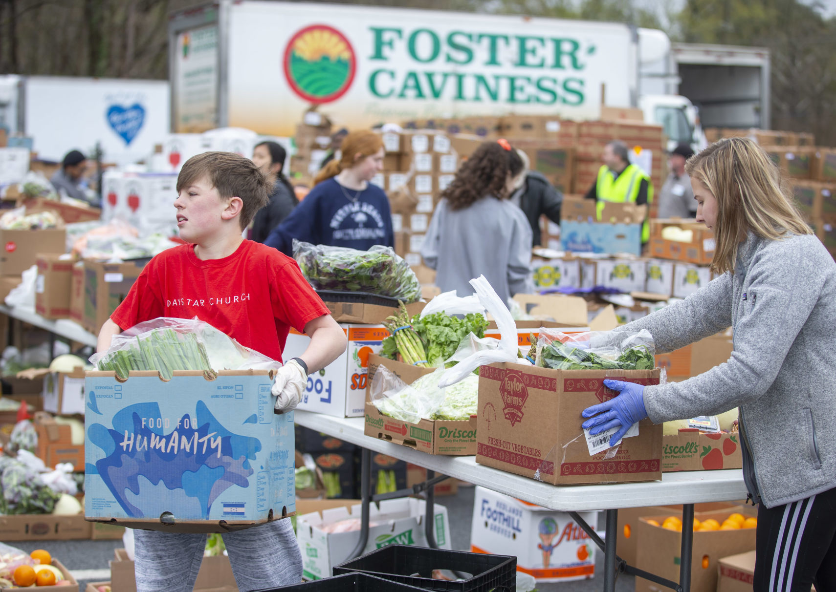 Crowds flock to produce giveaway at Daystar Church